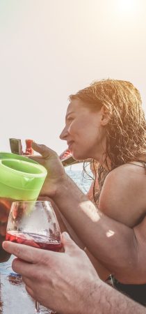 Friends enjoy lunch in a boat while sailing