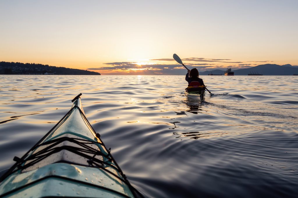 Sea kayaking while sunset
