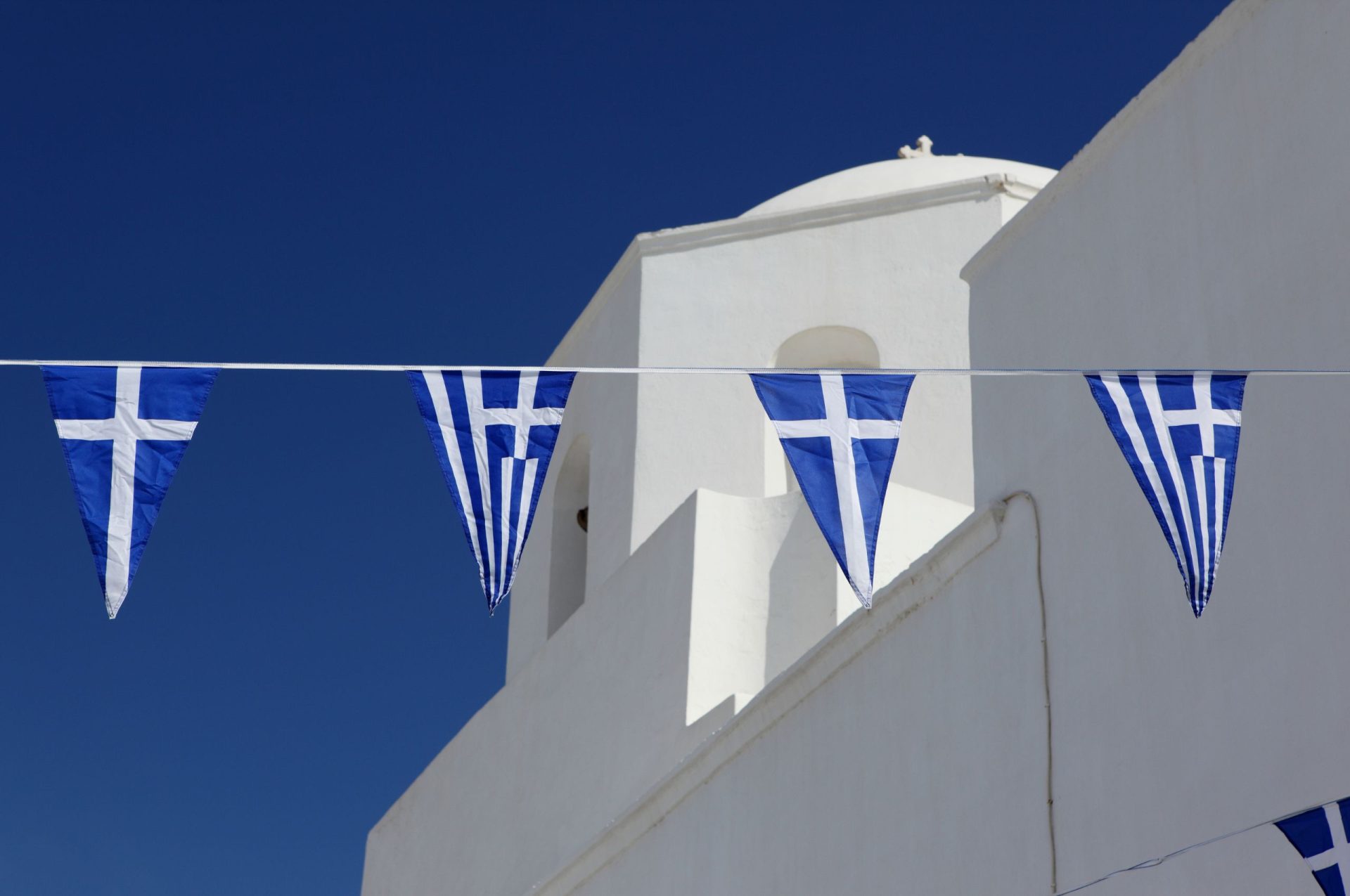 Cretan Music and Dance - church with flags - CV