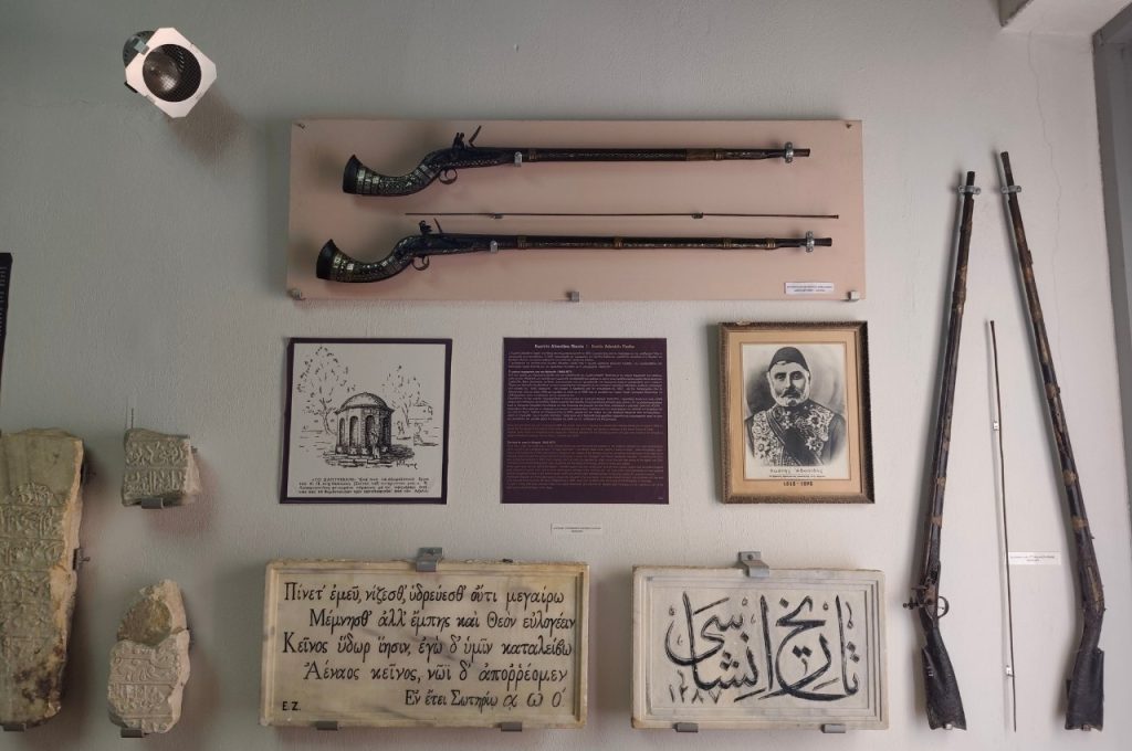 cultural and folk museum in crete inscriptions and wall hanged weapons - PE